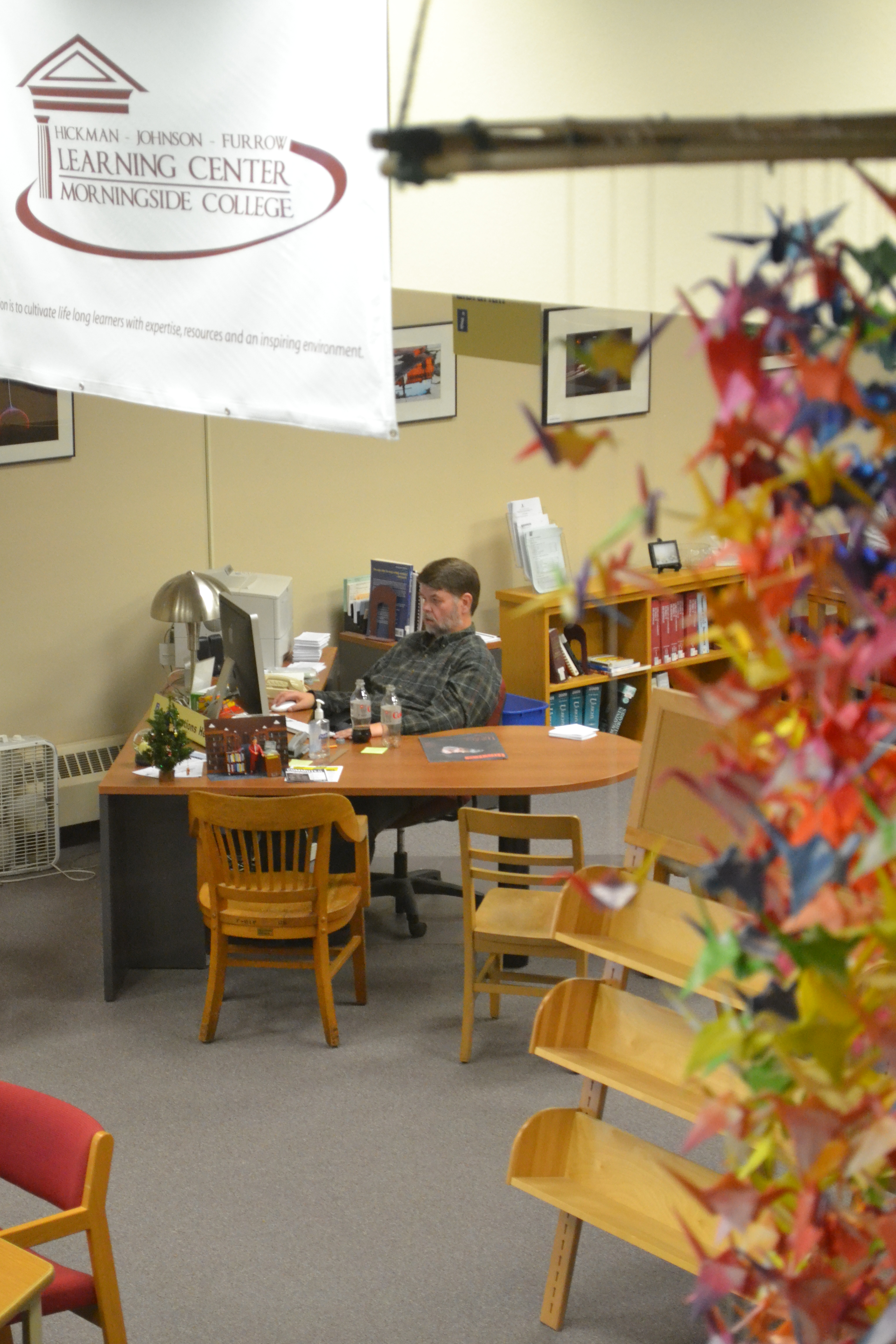 Morningside librarian Jim Fisk works at his desk Tuesday.