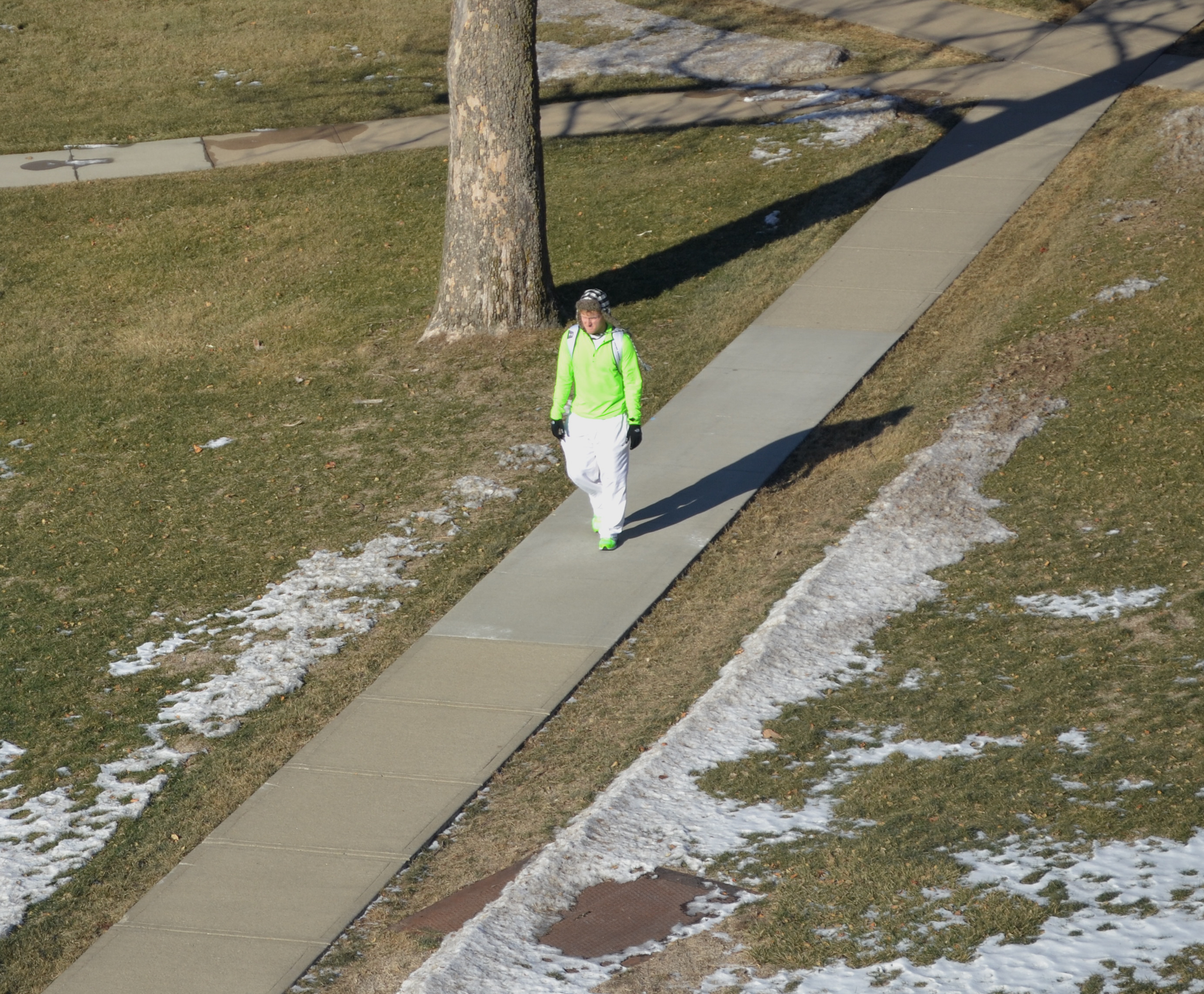 A Morningside student struts across campus in his neon jacket and shoes Tuesday.