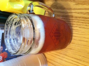 A mason jar filled with chilled Fat Tire lager. Yes, please.