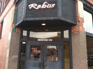 Signage above the door at Rebos