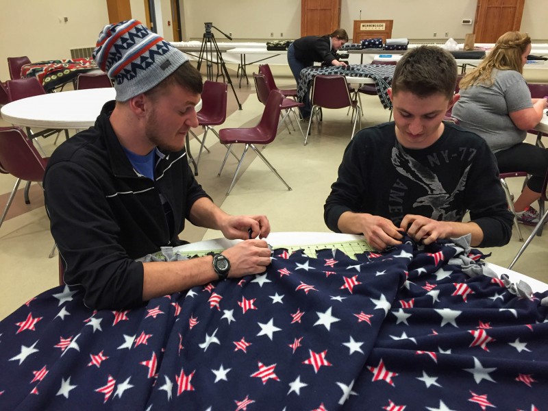 Students Tie Blankets For Shelters